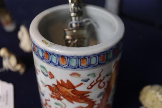 A Chinese porcelain dragon-decorated brush pot and a small gilt and white metal knife with sheath (2)